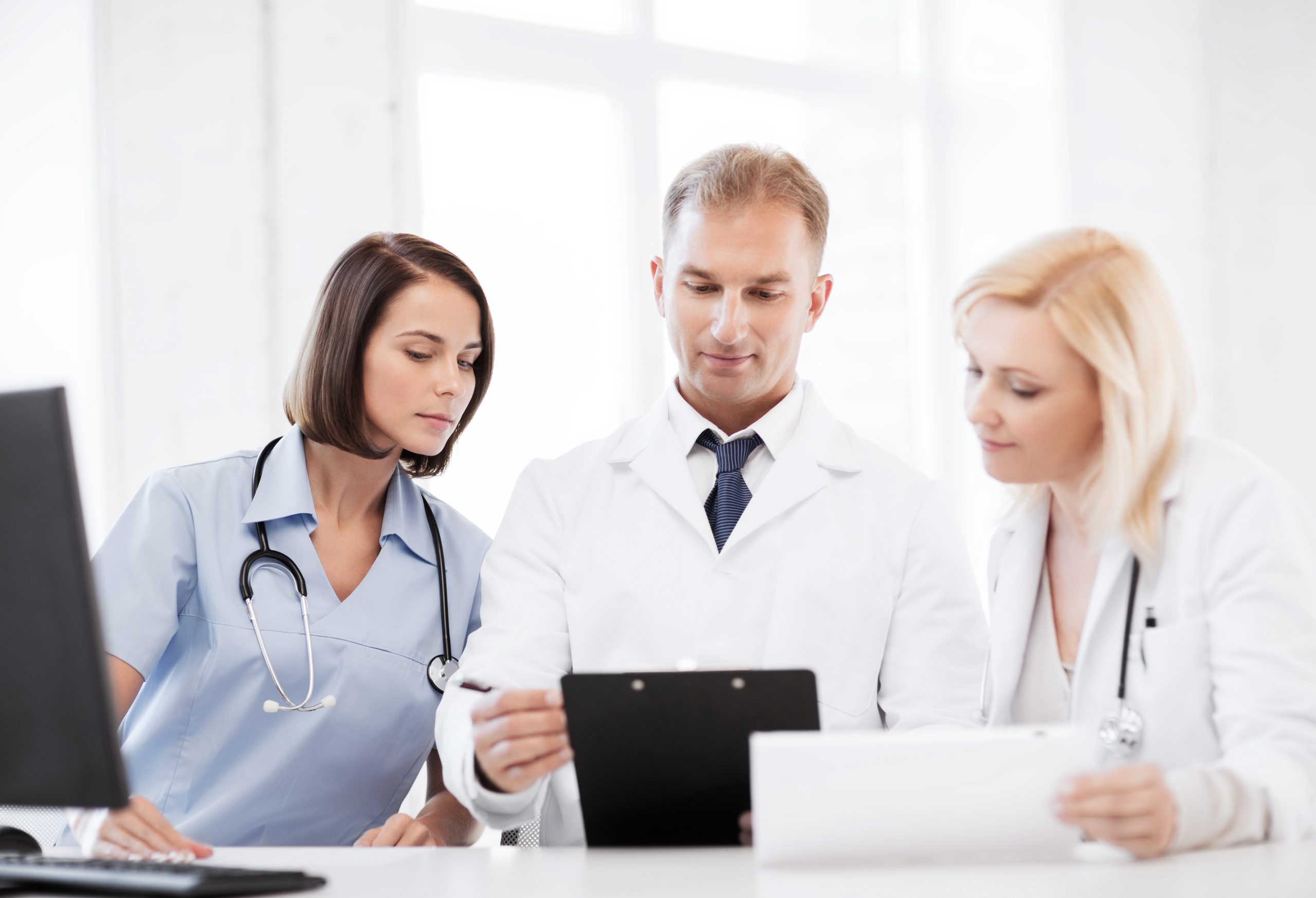 healthcare and medical concept - team or group of doctors on meeting